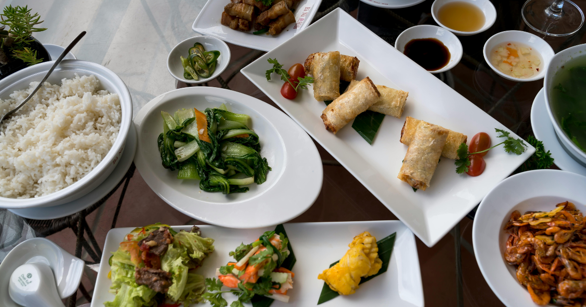 Table set with various homemade dishes, emphasizing the importance of healthy food for overall wellbeing.