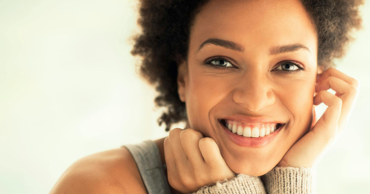 Image: Woman with a captivating smile, epitomizing the essence of beauty.