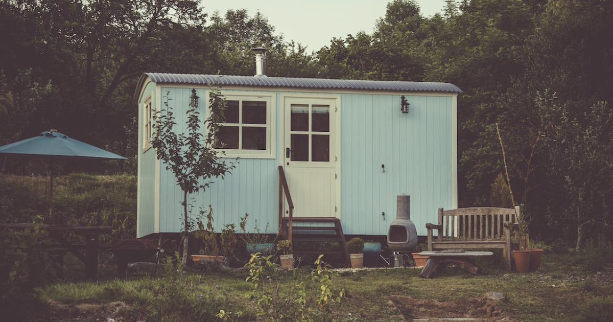 A cozy tiny house nestled in the wilderness, exemplifying off-grid living