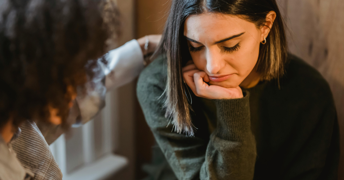 Woman Receiving Support from Friend in Divorce Aftermath