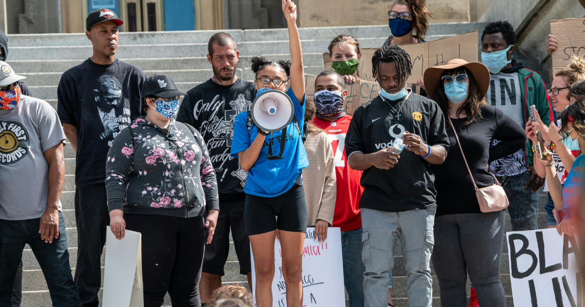 Image : Protesters questioning authority.