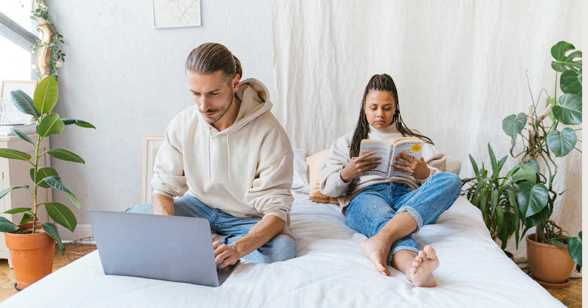 Image: A childfree couple immersed in their own hobbies or work, highlighting the positive aspects of not having the responsibility of children.