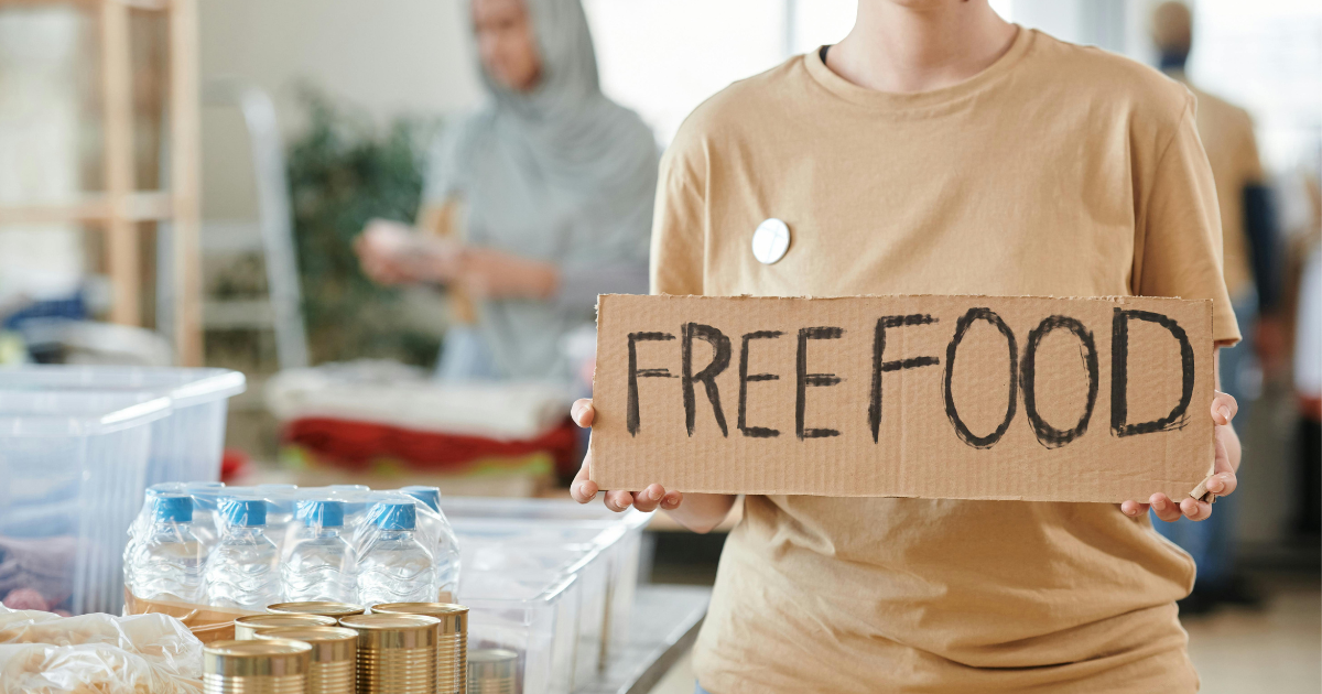 Volunteers serving free food at a food camp