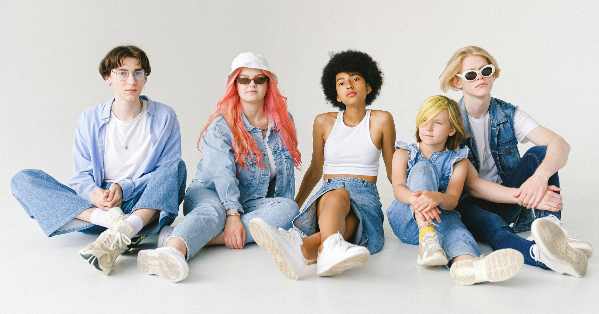 Teenagers and adolescents sitting and posing in summer denim fashion.