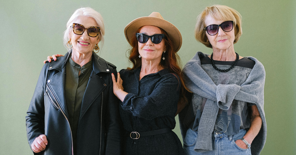 An image of a group of senior women standing together as close friends, illustrating the importance of making friends in the journey of finding fun and love later in life.